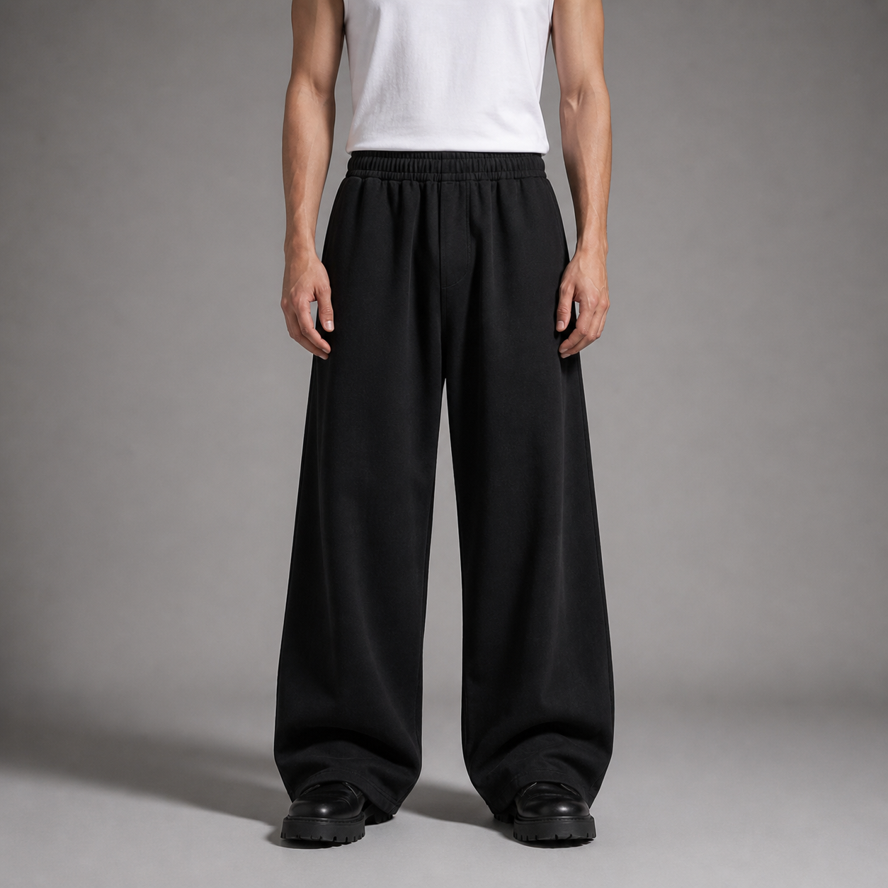 Person wearing black wide-leg pants and a white shirt on a gray background

شخص يرتدي بنطالًا أسود واسع الساق وقميصًا أبيض على خلفية رمادية