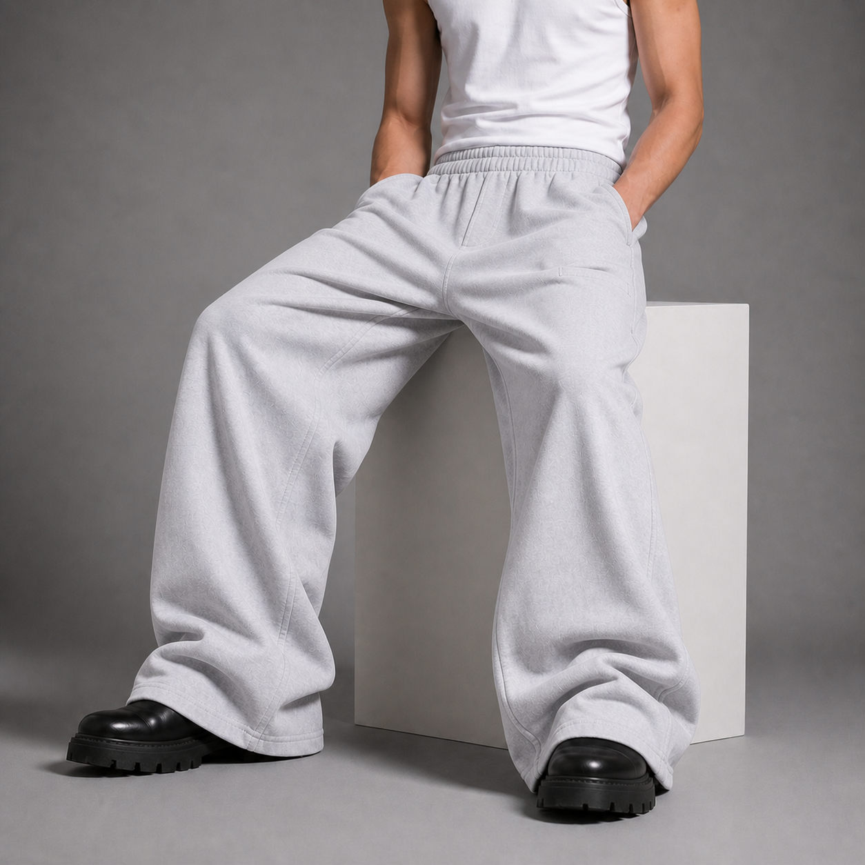 ARC Person wearing light gray sweatpants and black shoes on a gray background