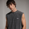 Man wearing a gray sleeveless shirt with 'ARC' logo against a neutral background
Close-up of ARC Sleeveless Acid Wash T-Shirt fabric showing the acid wash texture, stitching details, and premium cotton material.