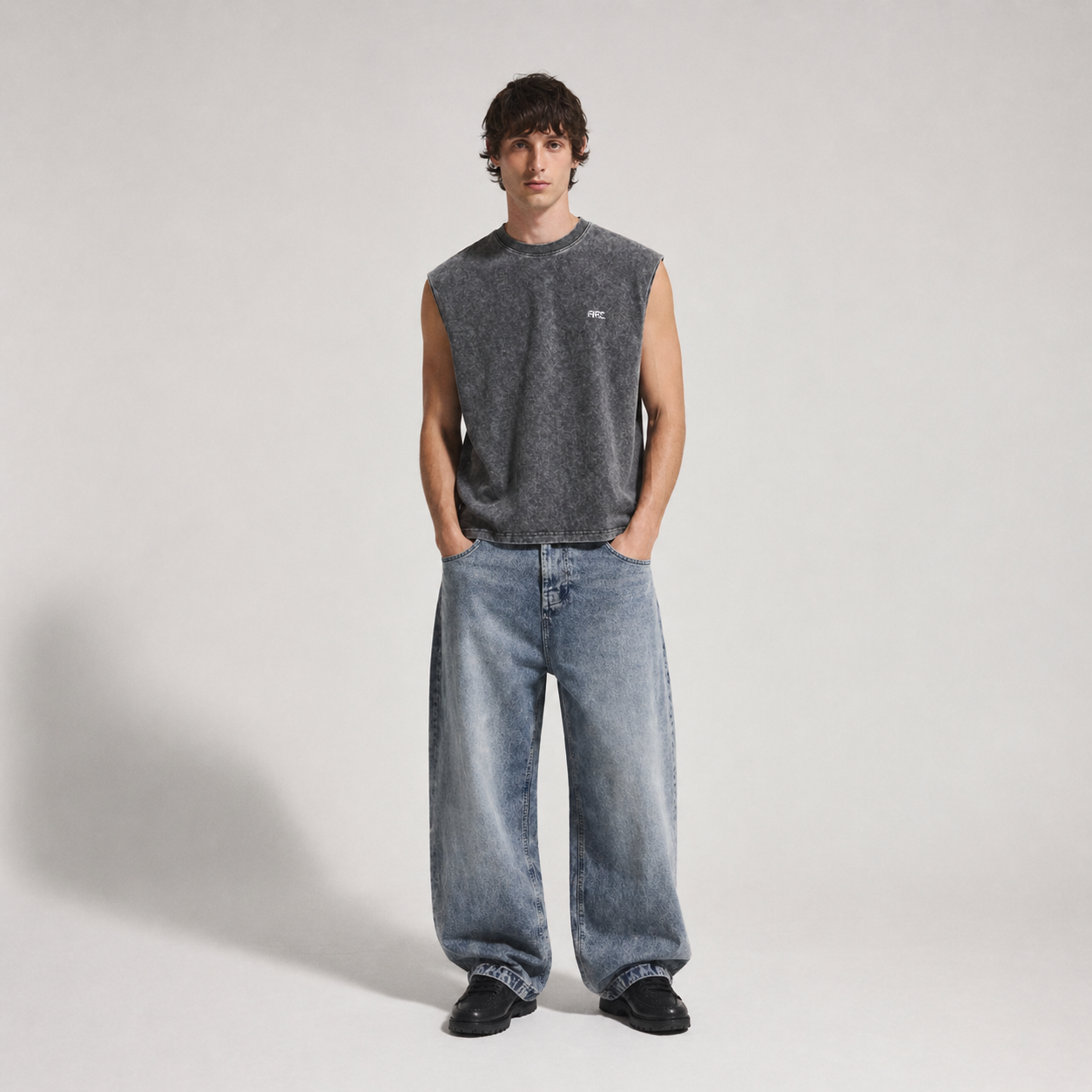ARC Sleeveless Acid Wash T-Shirt front view showing the acid wash texture, relaxed fit, and sleeveless design.